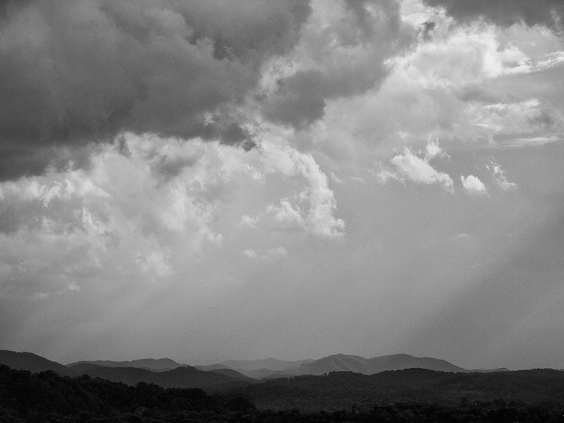 sun rays through clouds black and white