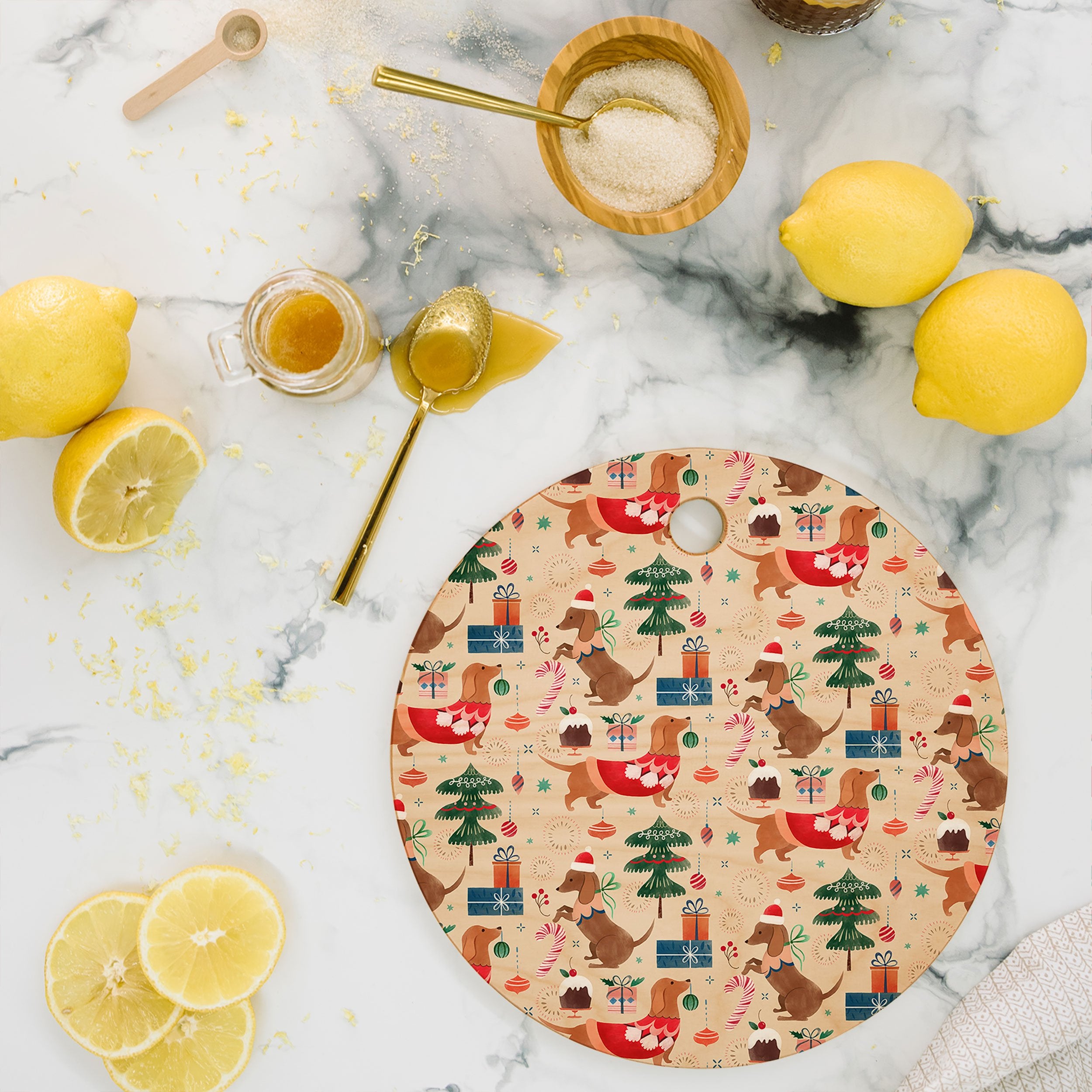 https://cdn.shopify.com/s/files/1/1418/4810/products/pimlada-phuapradit-christmas-dachshund-cutting-board-round_5000x.jpg?v=1637434783