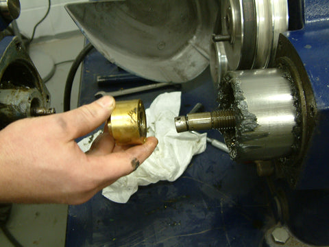 Remove the rotor feed bushing