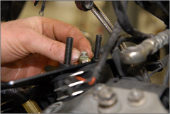 Close up of mechanic installing a valve stem seal