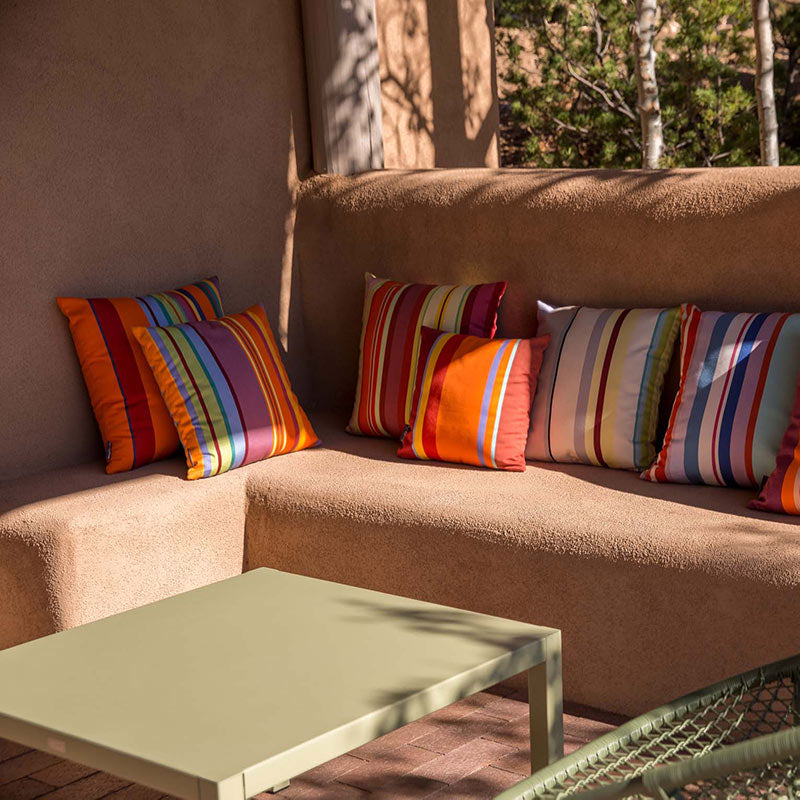 Custom striped sunbrella outdoor pillows on banco in Santa Fe, NM