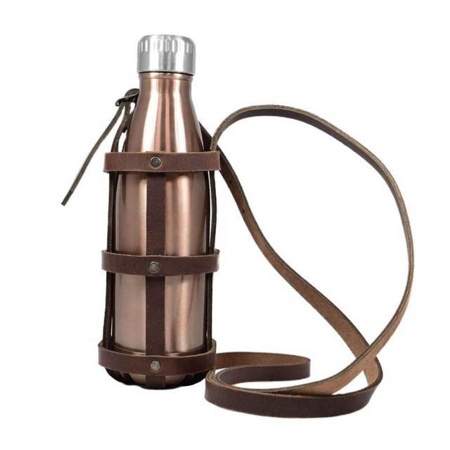 leather water bottle holder holding rose gold stainless steel water bottle