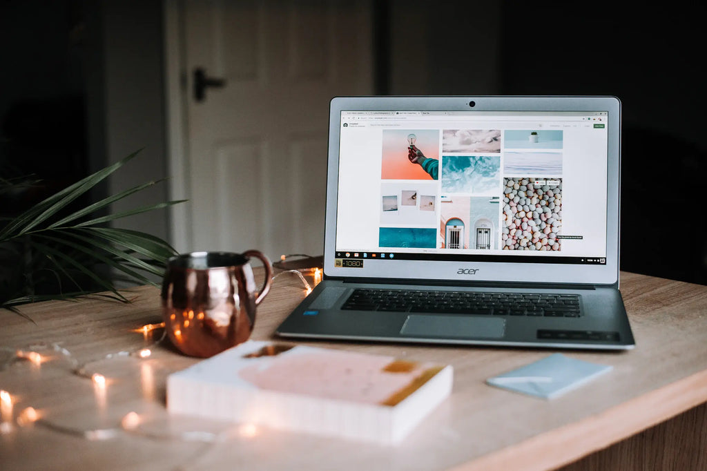 a copper cup and a laptop