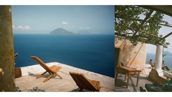 rooftop balcony in alicudi overlooking deep blue ocean with islands in the background