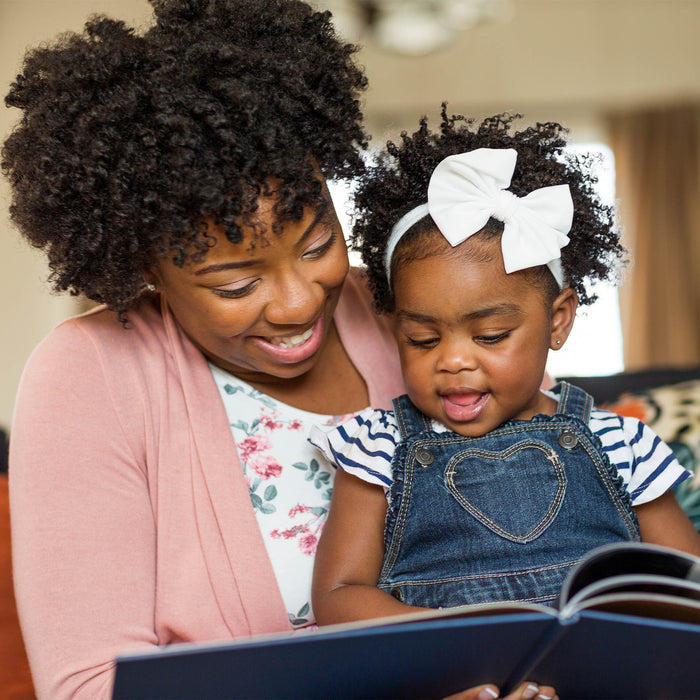 Mom and daughter reading a book