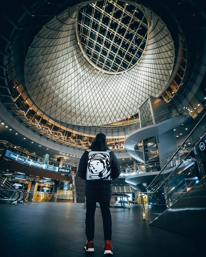 modal wearing the Billionaire Boys Club Private Label - Reflective Backpack in a mall