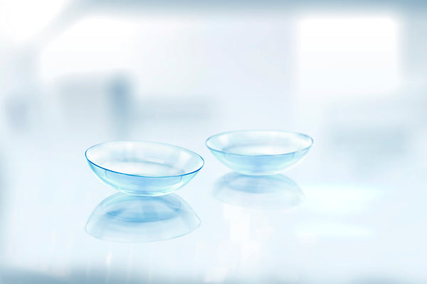 A pair of clear contact lenses.