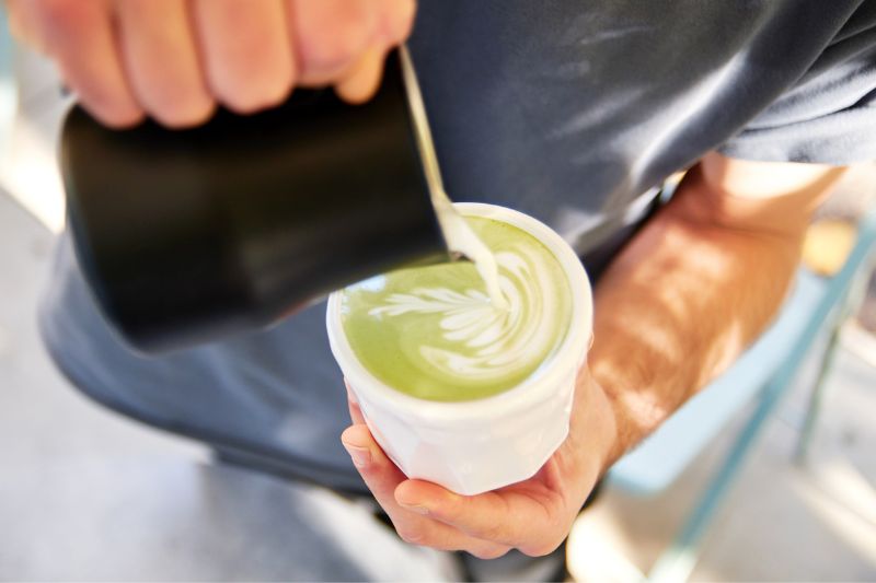 Pouring milk in matcha