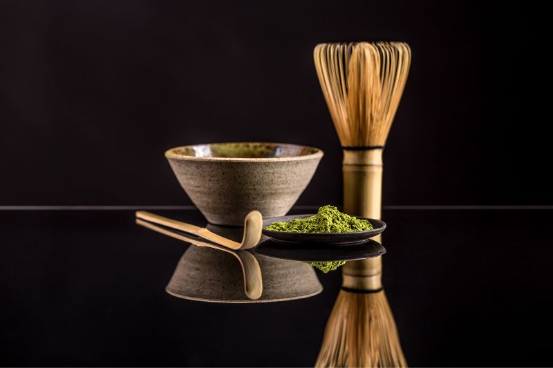 matcha with bamboo whisk and bamboo spoon