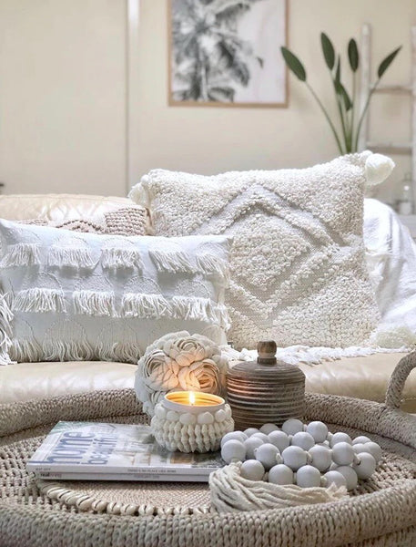 candle and textured cushions