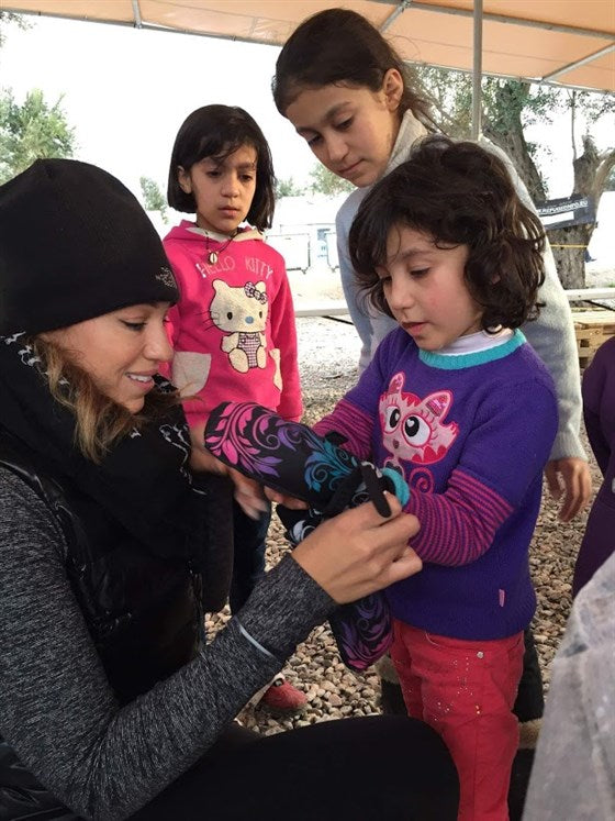 Somer Sood humanitarian aid worker operation refugee smile syrian refugees greece assistance support refugee children 