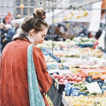 Female walking through the Farmers Market