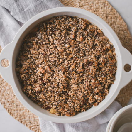 Feijoa crumble in a white dish