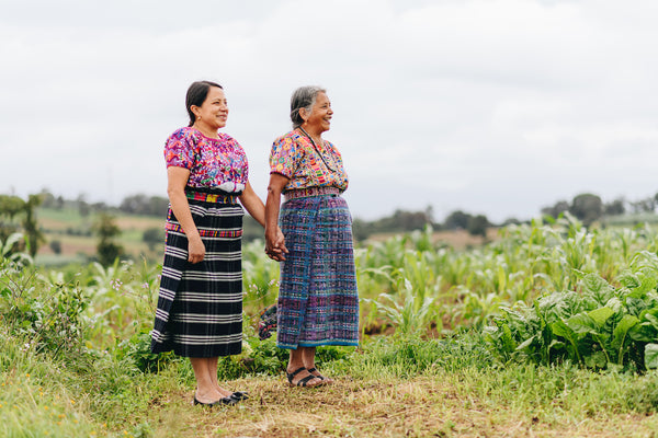Two indigenous women Artisans in their traditional Guatemalan outfits