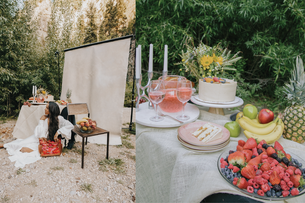 A collage of two images. On the left side is an image of a black female model laying on the ground outdoors in front of a backdrop, table with fruit, chair, and a purse. The other image is an close up of the table with the fruit.