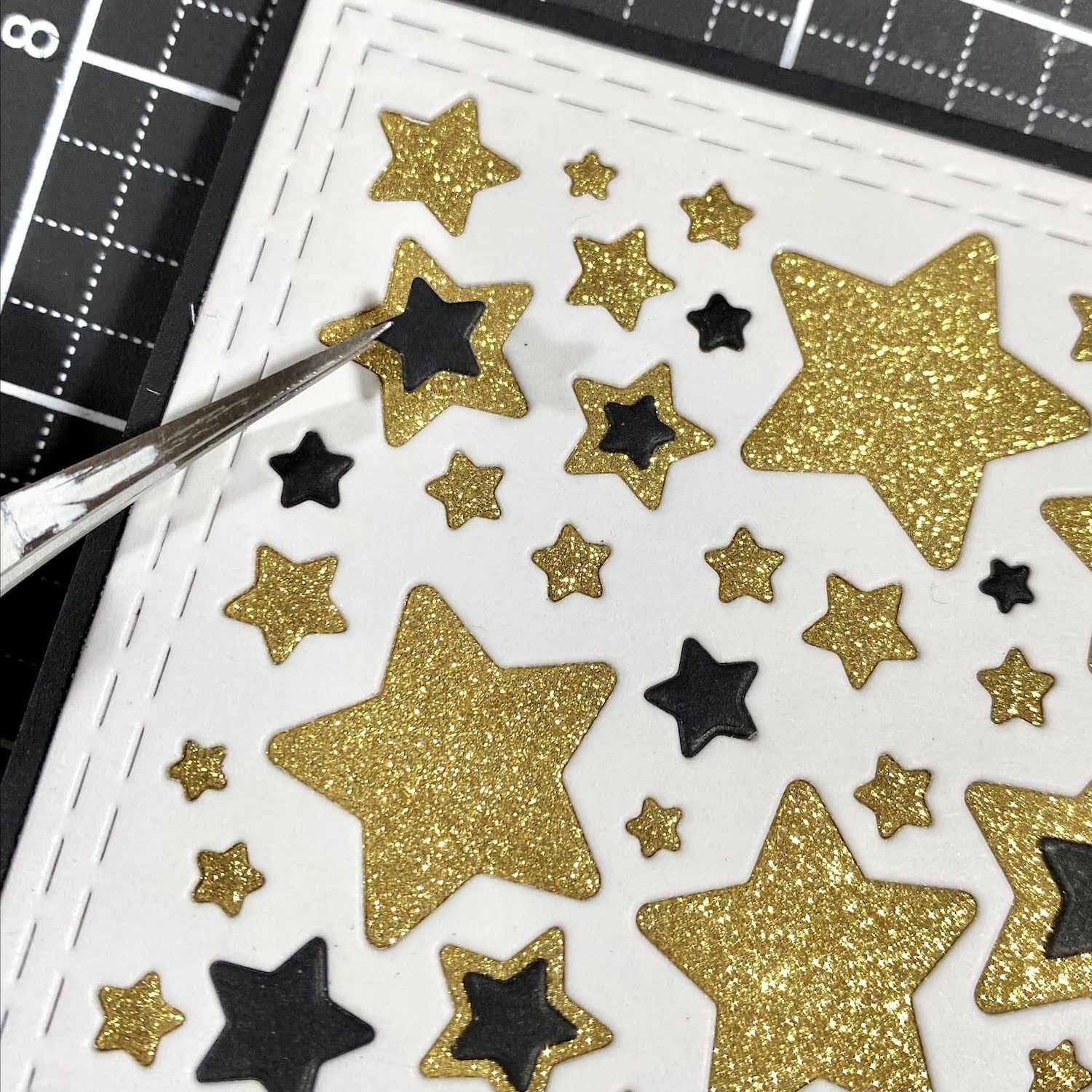 adding Sirio Ultra Black stars to tops of glitter stars