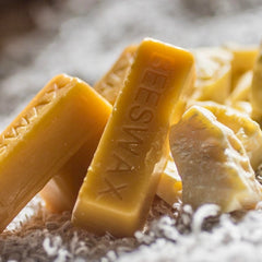 Amber colored blocks of beeswax.