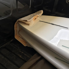 Two Grey Duck paddle boards in the back of a truck.