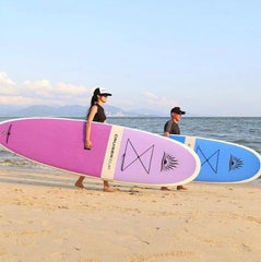 Two people stand up paddle boarding
