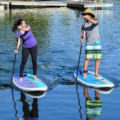 A couple paddle boarding on the Cruiser SUP Dura-Maxx boards
