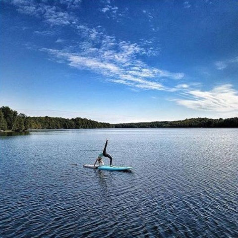 Stand up paddle yoga on a Cruiser SUP stand up paddle board