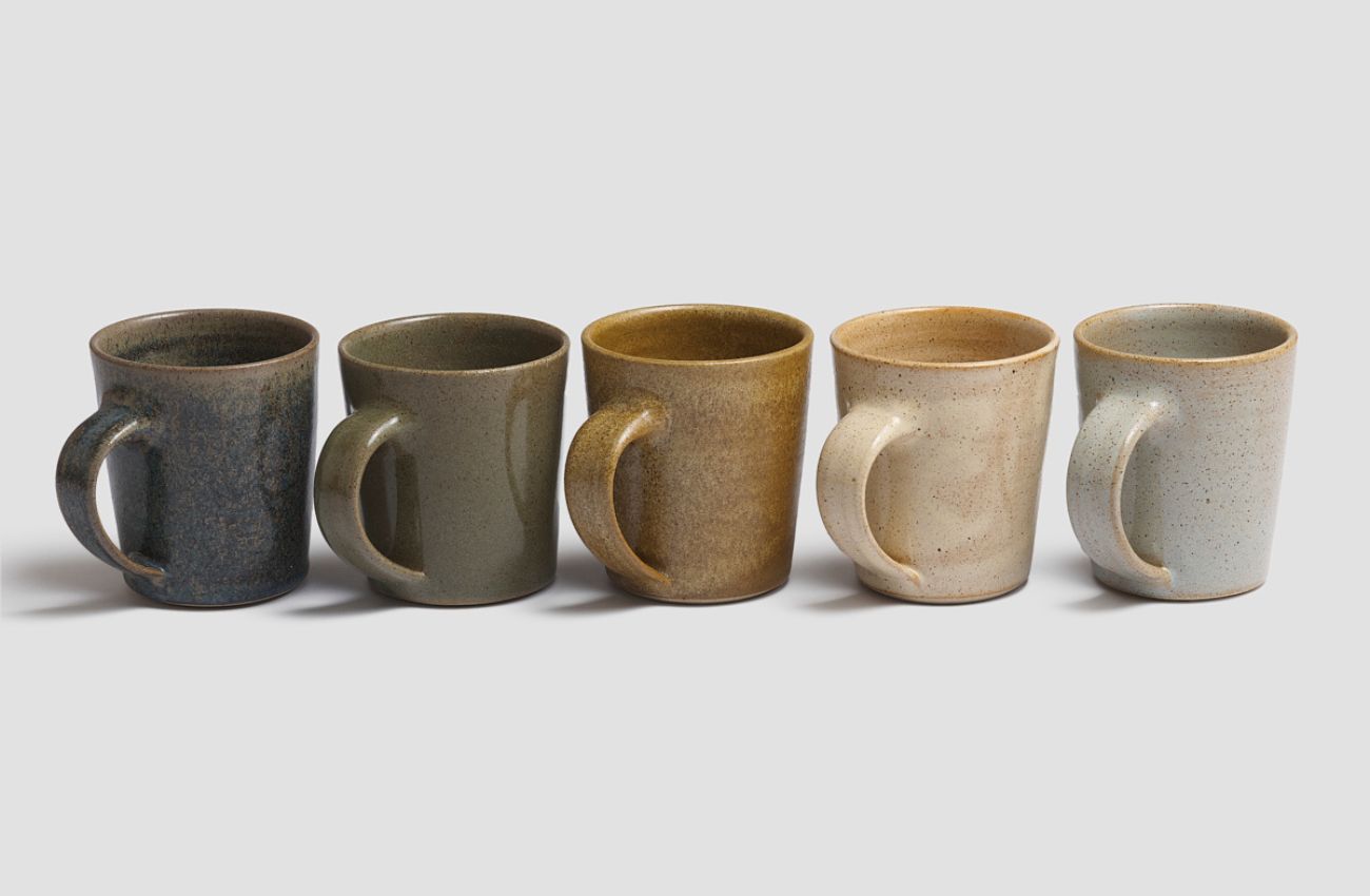Line of Pottery West flecked stoneware mugs in five different glazes