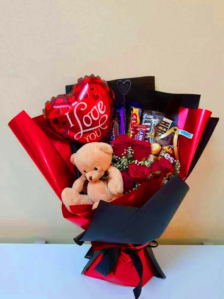 teddy bear with flowers and chocolate