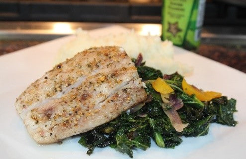 Baked Mahi-Mahi on a bed of braised kale, red onions and yellow peppers