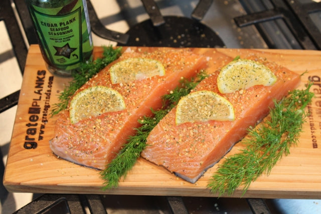 Salmon filets on cedar planks with Cedar Plank Seafood Seasoning ready for the oven or grill