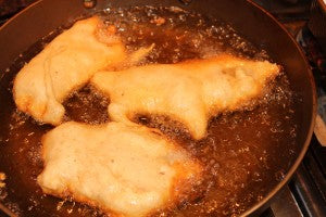 Battered cod frying
