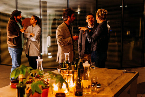 group of people at party gathering socializing | Goldleaf