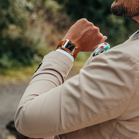 Square watch with black dial and gold case from SÖNER - on arm