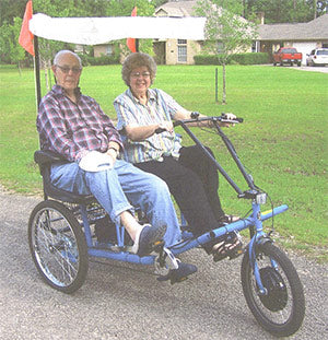 Betty and Grady Smith on thier electric tricycle.