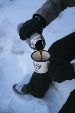 Pouring hot beverage into a mug