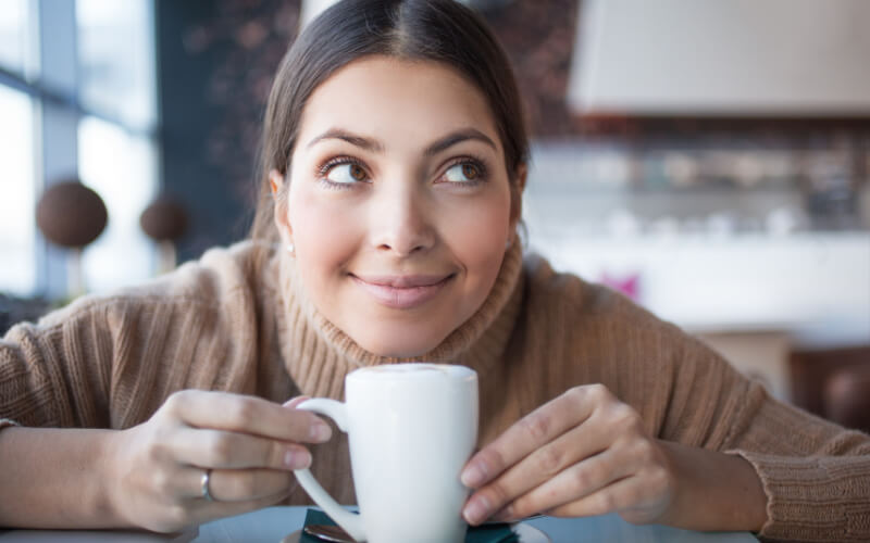 Is Coffee Good For Your Skin woman with cup of coffee