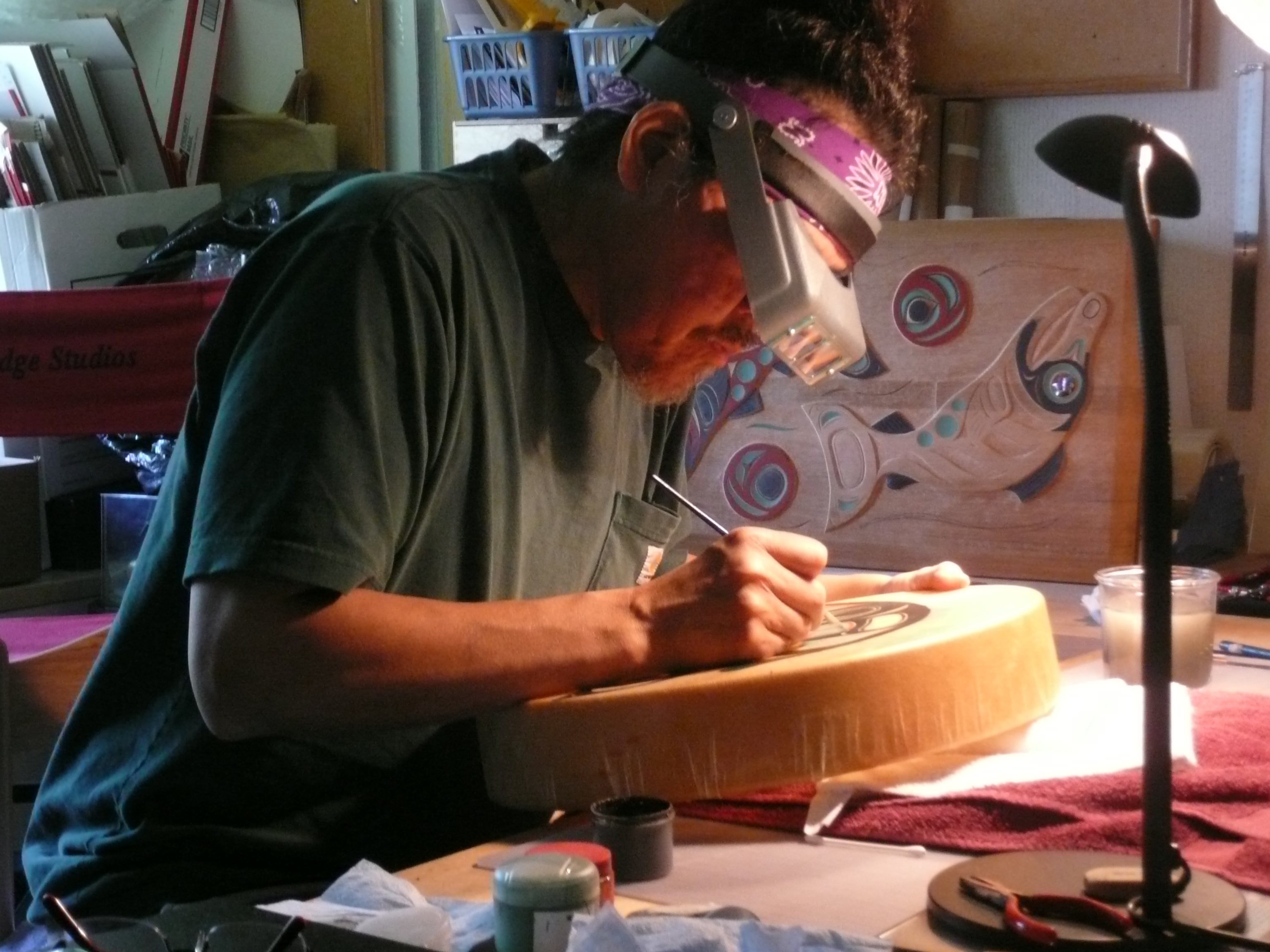 Tlingit Master Artist Israel Shotridge Drawing Formline Art on a Drum