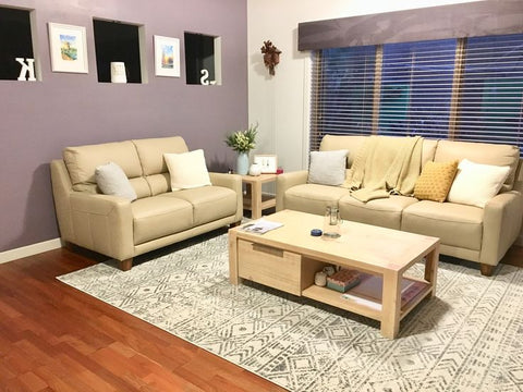 Grey rug beige sofa
