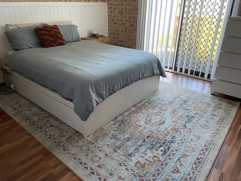Blue rug grey bed linen