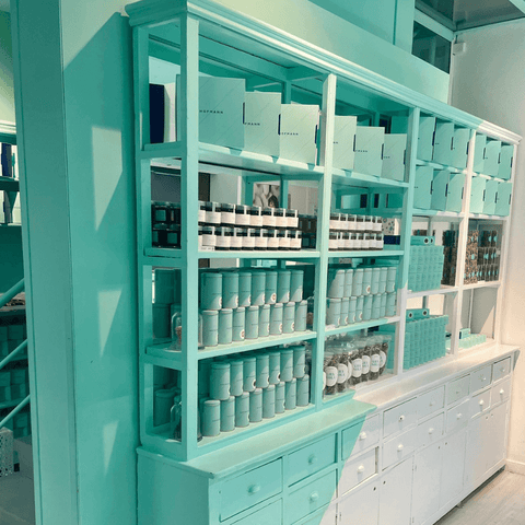 Camoflaged storage - paint the shelves the same colour as the walls. As seen at (amazingly good) cult pattiseria, Hoffman