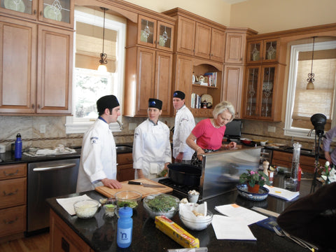 Christy with Culinary Students in her completed kitchen