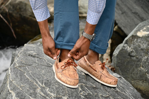 man wearing brown boat shoes