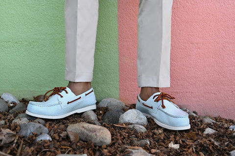 man wearing baby blue boat shoes