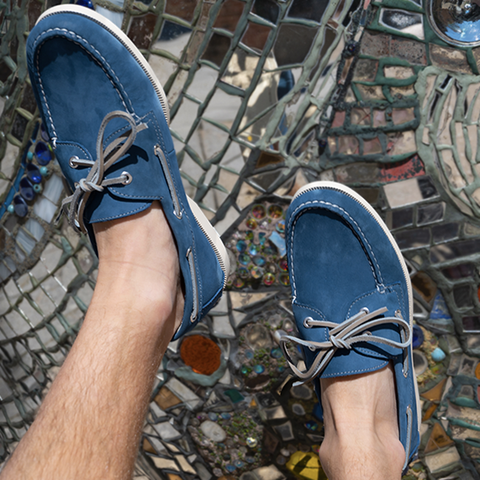 man wearing blue leather boat shoes