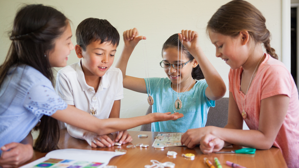 group of kids crafting pendant jewelry