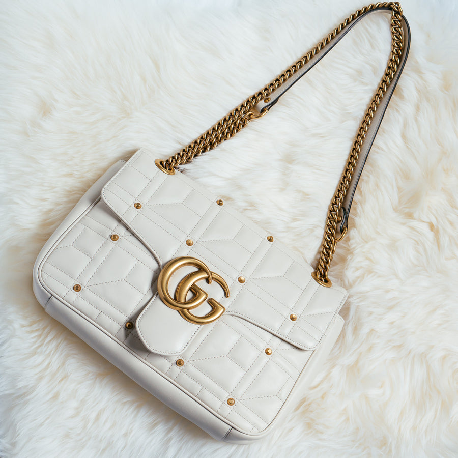 white and gold gucci bag