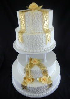 Ribbons And Lace Classic Gold Wedding Cake Tiffany S Bakery