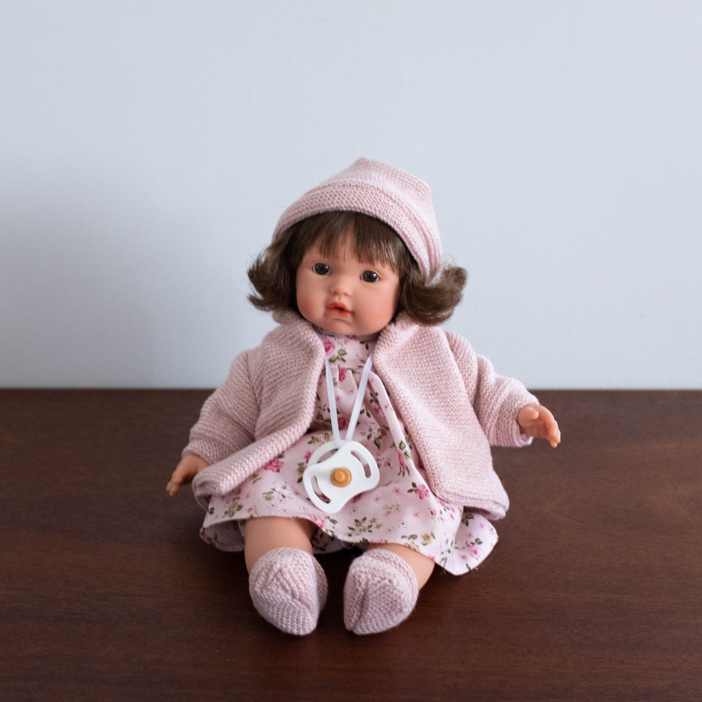 baby doll with pacifier that cries