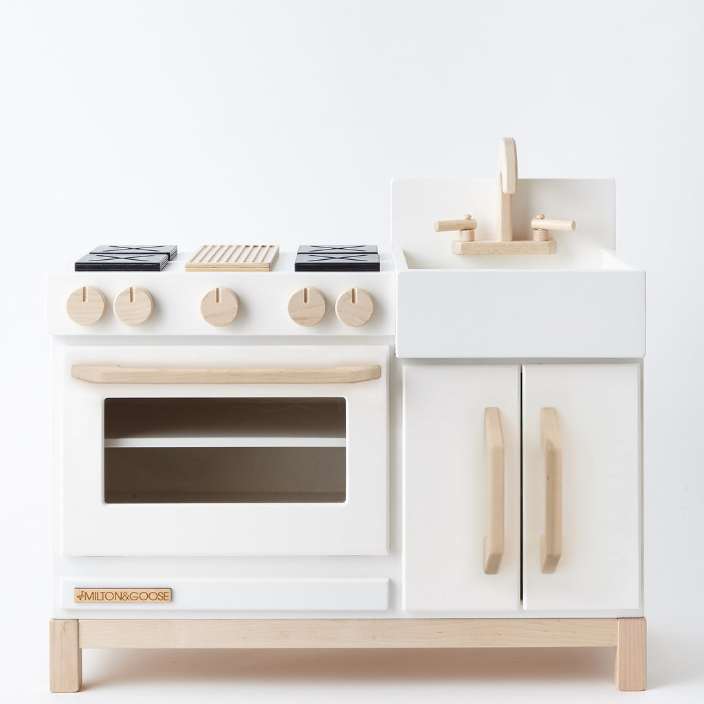 white wooden play kitchen