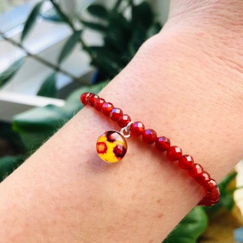 model wearing red covid 19 awareness bracelet
