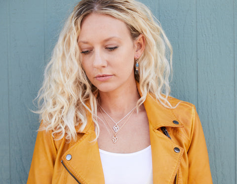 Model wearing sterling silver guardian angel necklace and 14k gold filled guardian angel necklace to show lengths